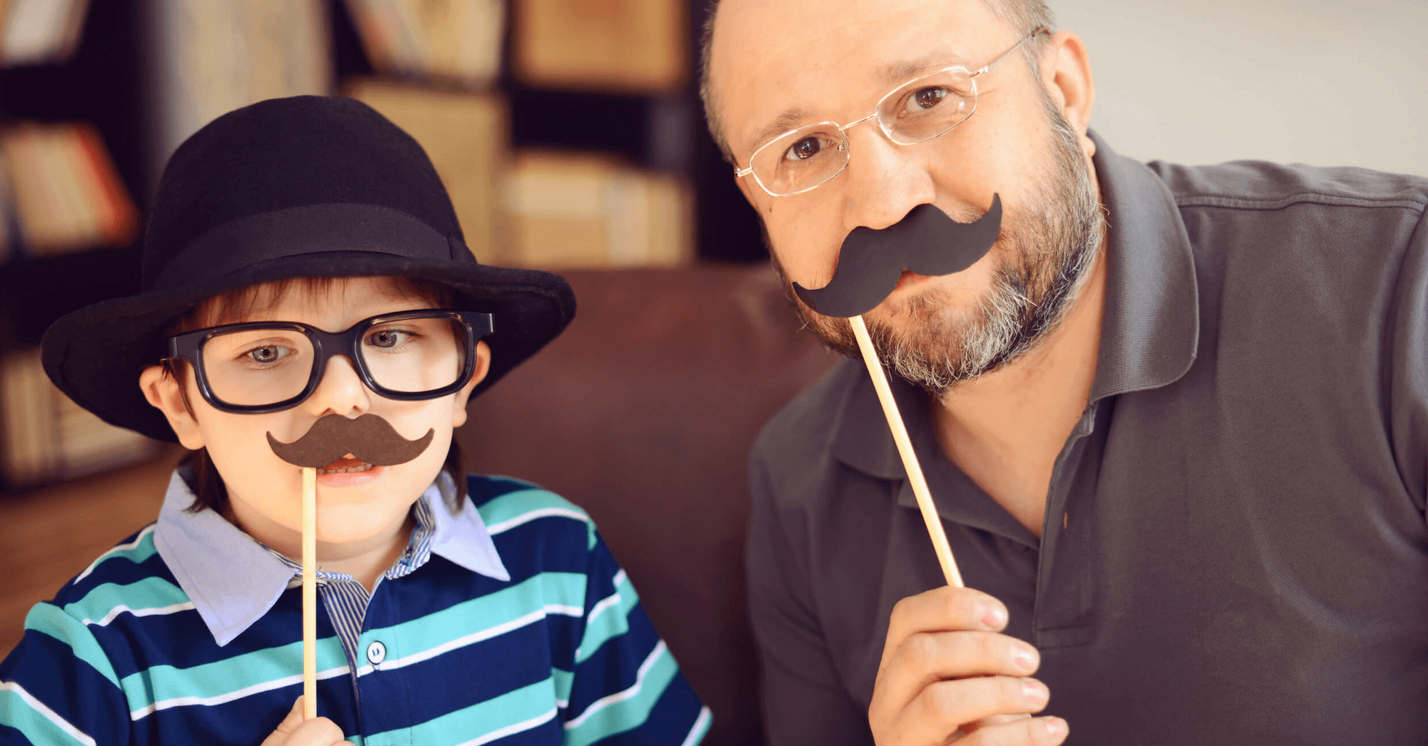 Man and boy with mustache disguises